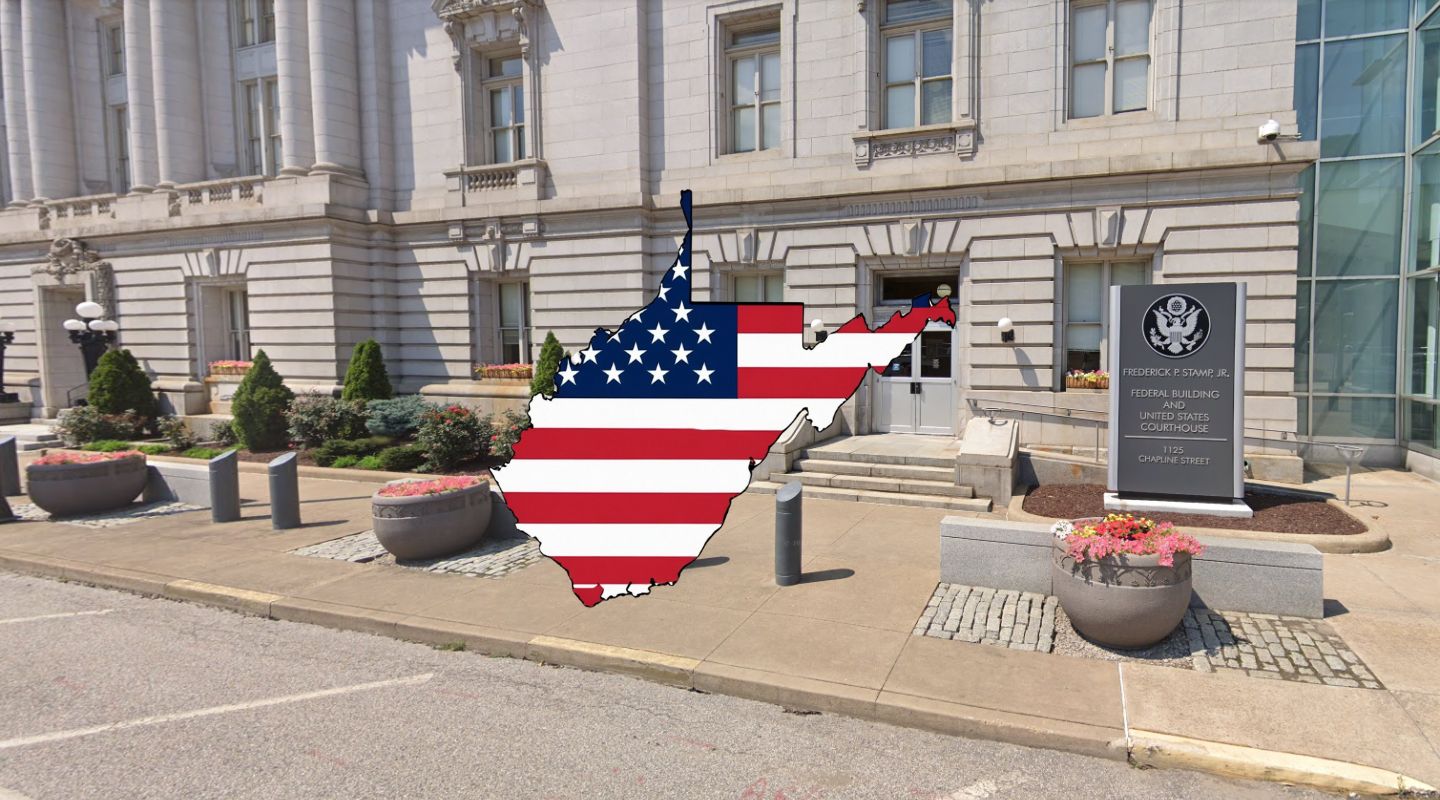 A building exterior with a U.S. federal courthouse sign. In front, a map of West Virginia is overlaid with the American flag design. The entrance is decorated with potted plants.