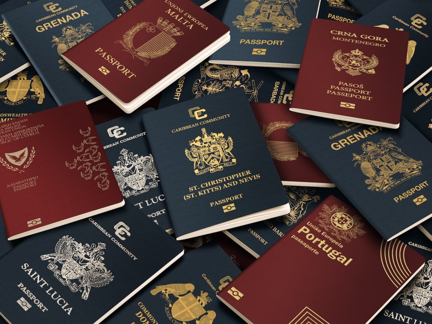 A scattered collection of passports from various countries, including Saint Lucia, Portugal, Malta, Montenegro, and others. The passports display different colors like maroon, blue, and black, with each featuring unique emblems and text.