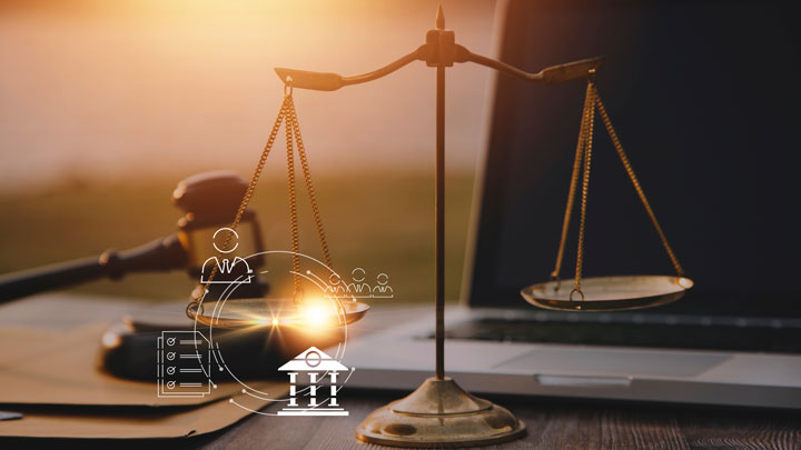 Scales of justice and a gavel on a desk with a laptop, overlaid with digital icons of a person, a group, a document checklist, and a courthouse, representing legal and institutional concepts.