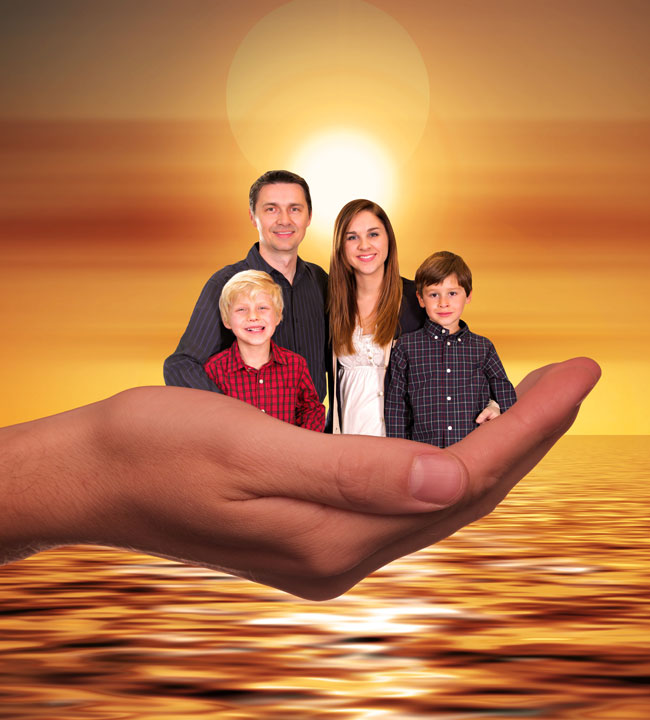 A man, woman, and two boys stand together, appearing to be held in a large open hand over a golden sunset reflected on water. The family is smiling, and the scene has a warm, surreal atmosphere.