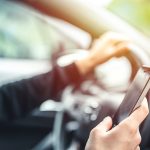 Driver using a smartphone while driving, distracted driving