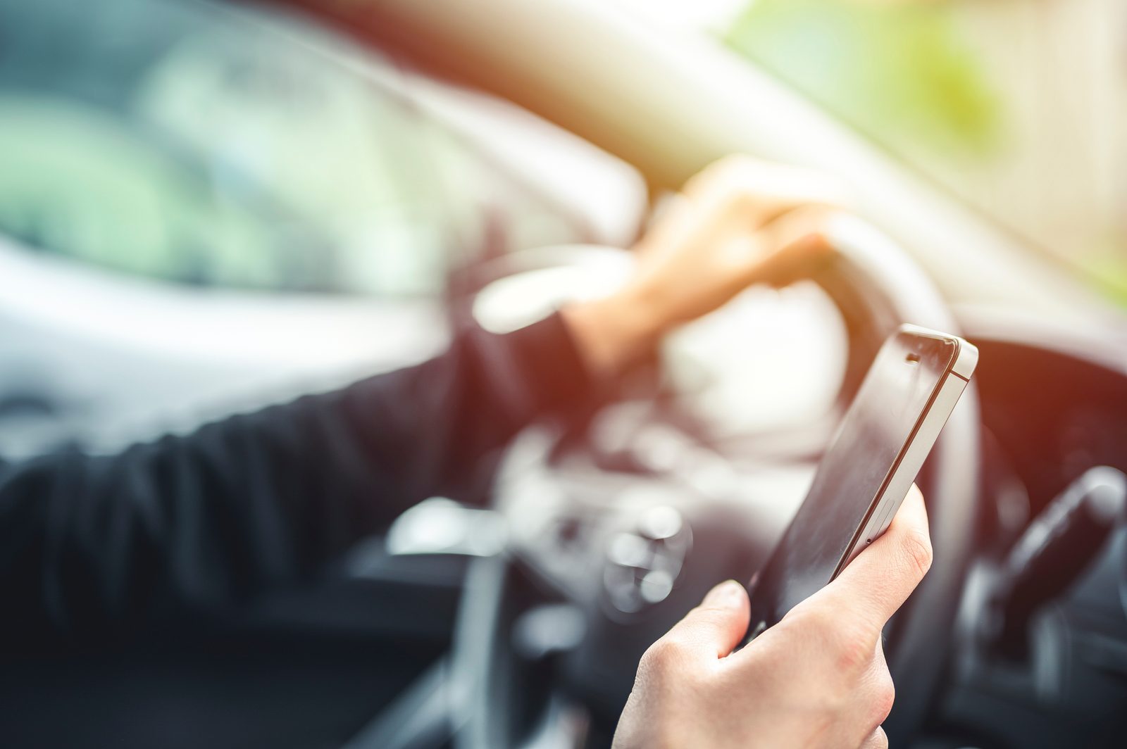 Driver using a smartphone while driving, distracted driving