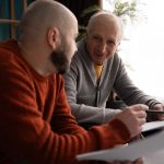 Parent reviewing legal paperwork with an advisor