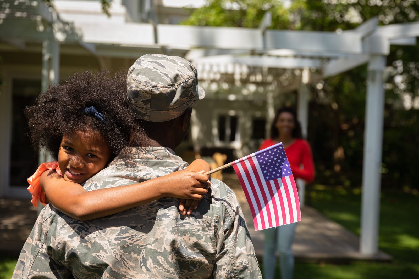 Soldier in uniform reuniting with his young daughter
